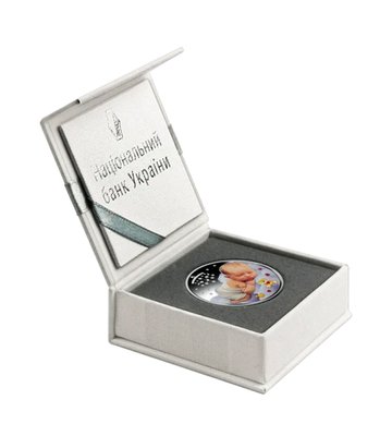 Parental happiness in gift wrapping - a silver coin